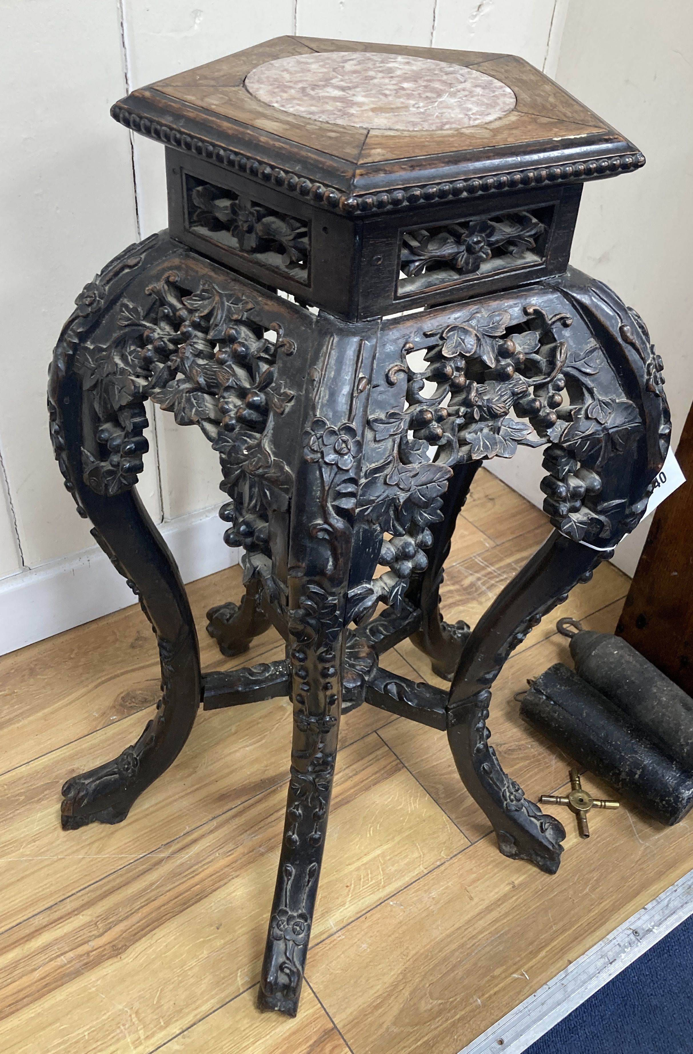 A Chinese marble top carved hardwood jardiniere stand, width 38cm, depth 38cm, height 66cm